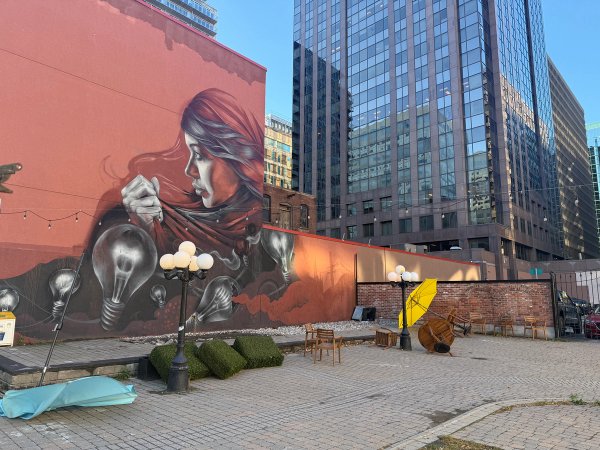 Illuminate street art mural photo 1