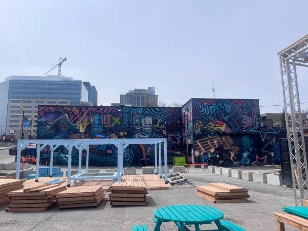 Mural titled C'est la vie by Phil Landry and Marin Mitrasinovic in Gatineau. Featuring psychedelic patterns and historical figures