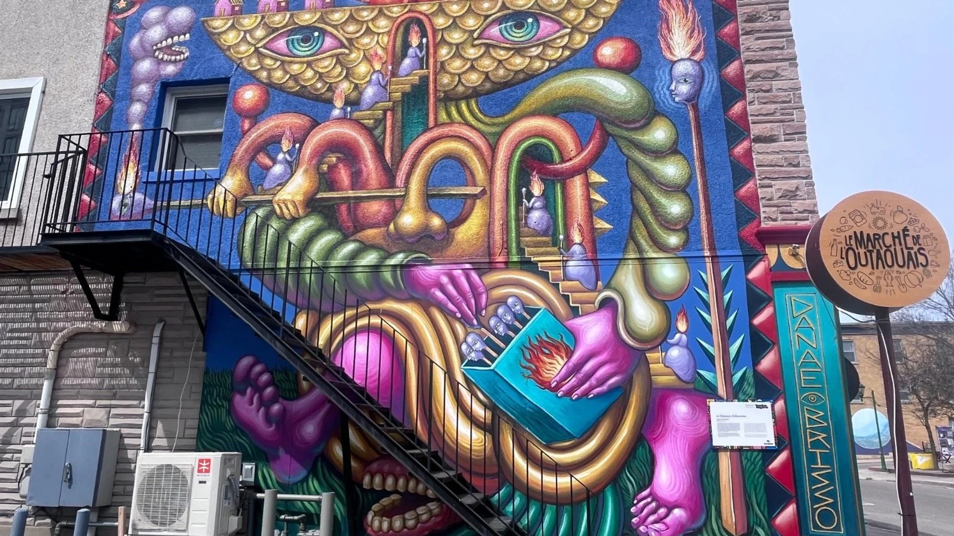 Danae Brissonnet’s 'The Matchstick Girl' mural in Hull, Gatineau. This street art piece archives the history of the E.B. Eddy factory, depicting the resilience and industrial labor struggle of 19th-century women in the National Capital Region.