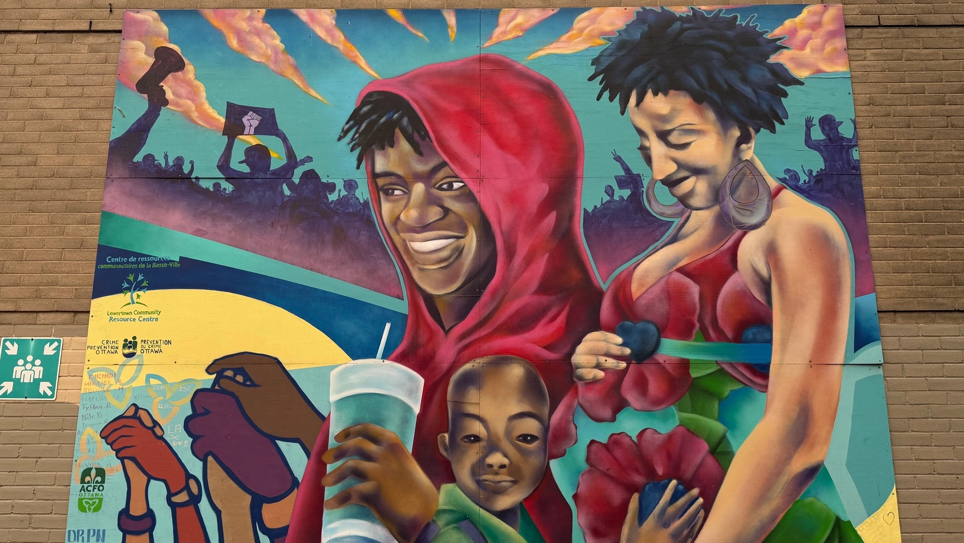 Lowertown Community Art: Powerful portrait mural by DRPN soul celebrating community and identity in Lowertown, Ottawa. Youth-led Public Art.