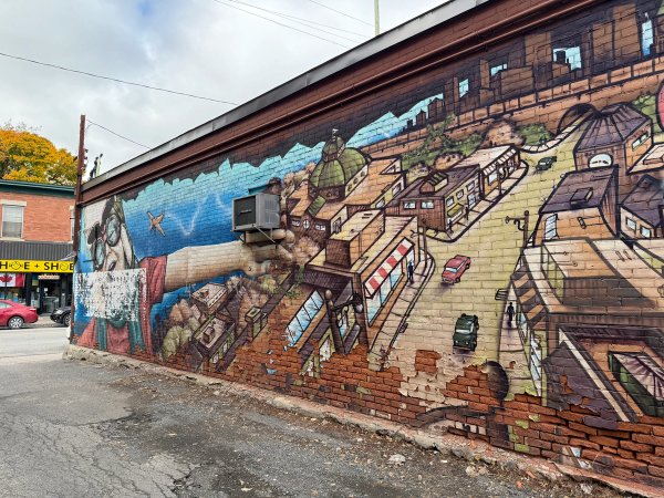 Flying Over street art mural photo 3