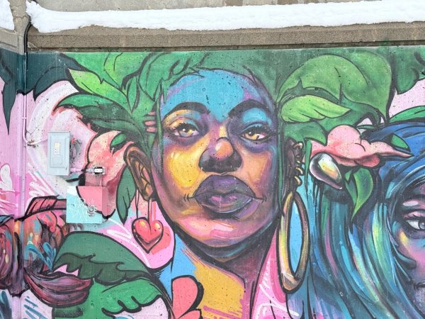 Mural artwork by Jimmy Baptiste - Street art in Byward Market, Ottawa, Ontario