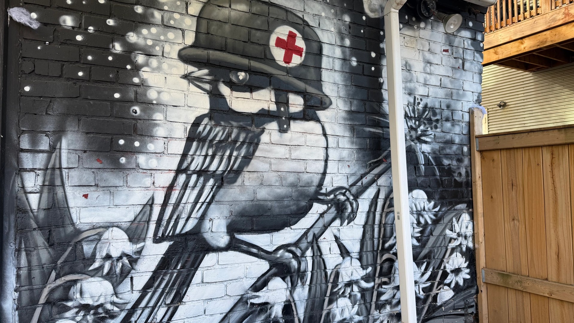 Daniel Martelock Bird on a garage door near Wellington Street West