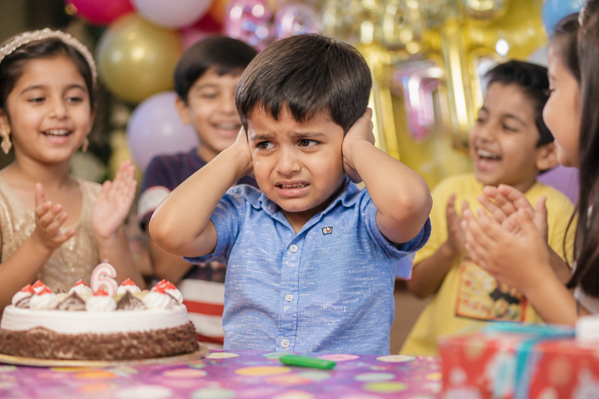Child covers his ears