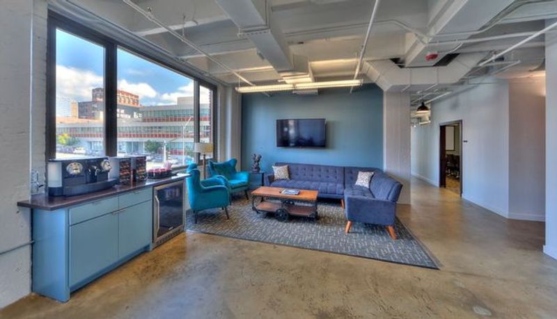 Office lounge with a coffee station and a downtown Kansas City view