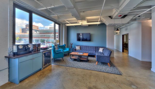 Office lounge with a coffee station and a downtown Kansas City view