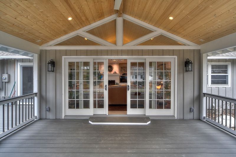 Screened porch with French doors into the home