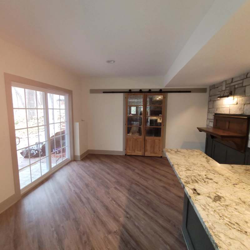 Sliding barn doors & the patio doors at the end of the basement