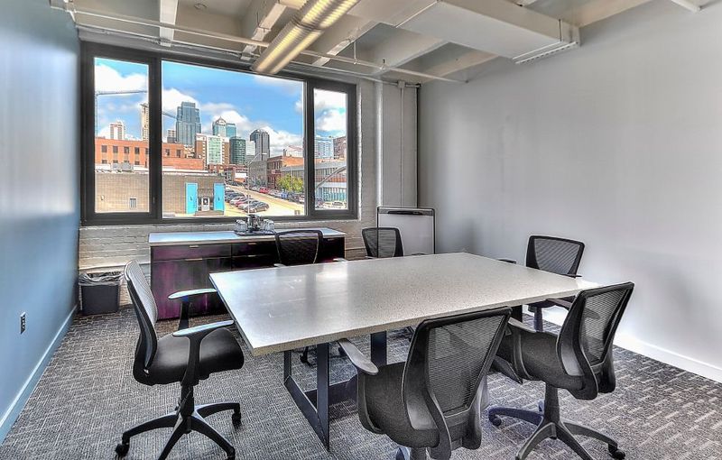 Commercial meeting room with a Kansas City skyline view through the windows