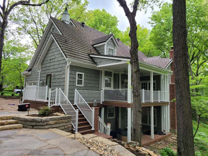 The rebuilt deck & stair at the back of the house above the flagstone patio