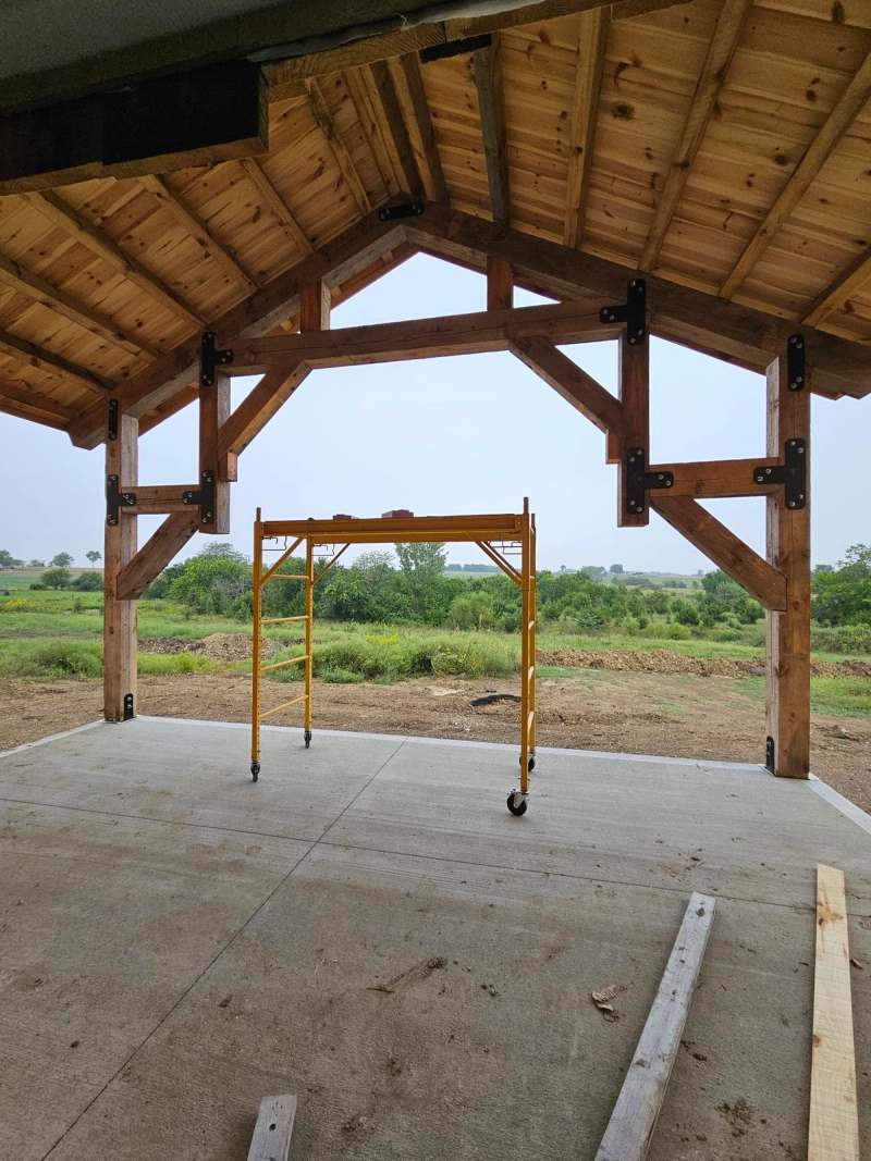 The porch truss from beneath, showing the timber joinery & the steel plate connections