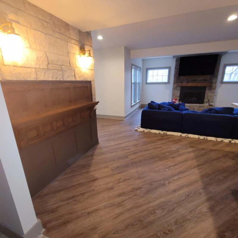 The antique back bar & stone wall, looking toward the family room fireplace