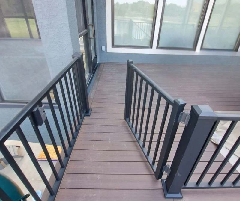 The finished deck surface and steel baluster rail, looking along the boards