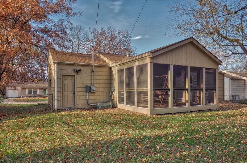 Screened porch with gabled roof built by All Under One Roof, Kansas City