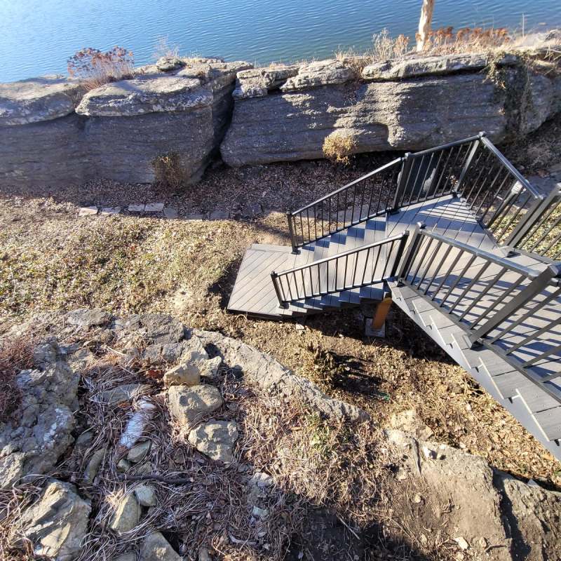 Composite stair flights & a landing stepping down past the limestone ledges