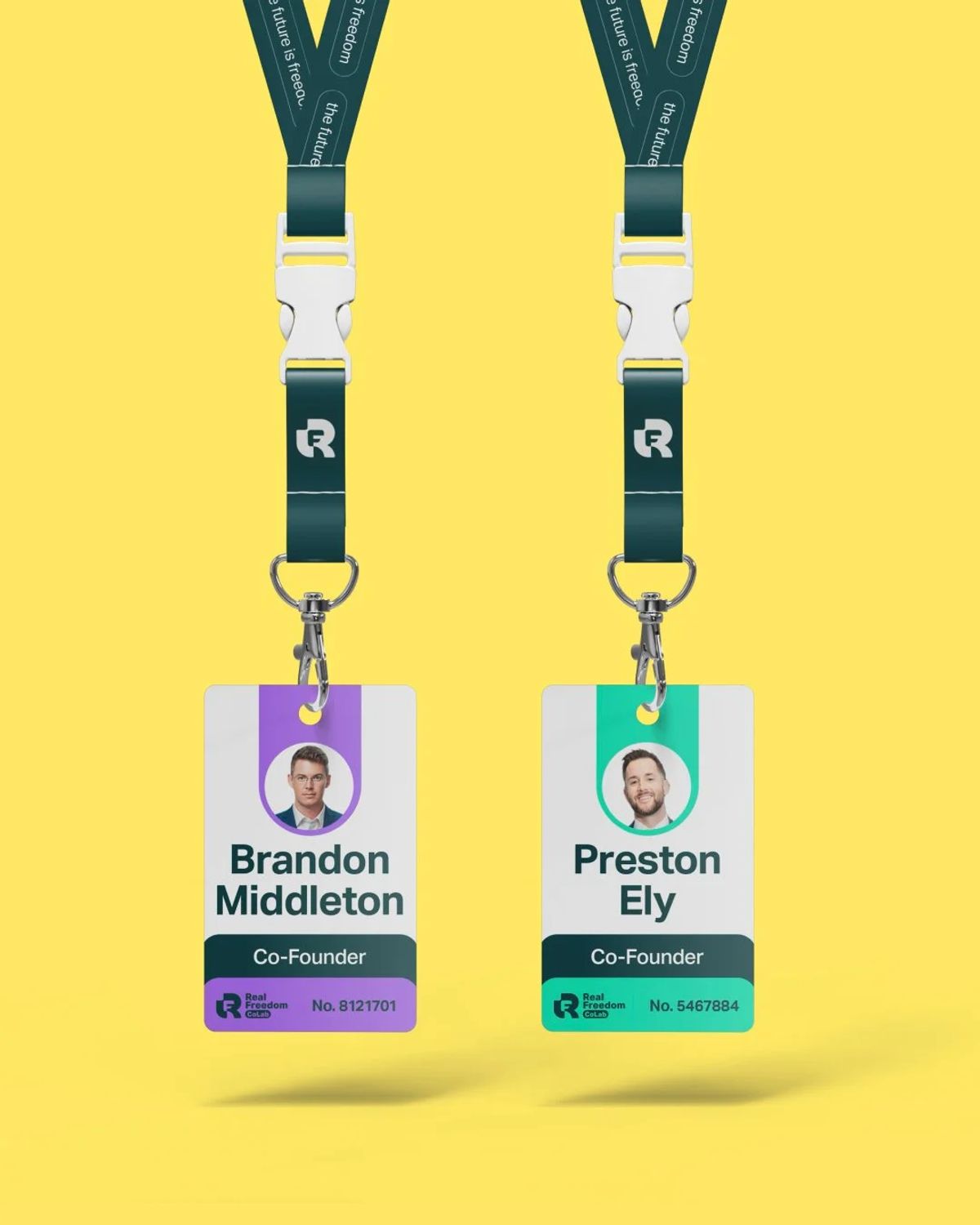 Two Real Freedom CoLab co-founder ID badges on dark green lanyards against yellow