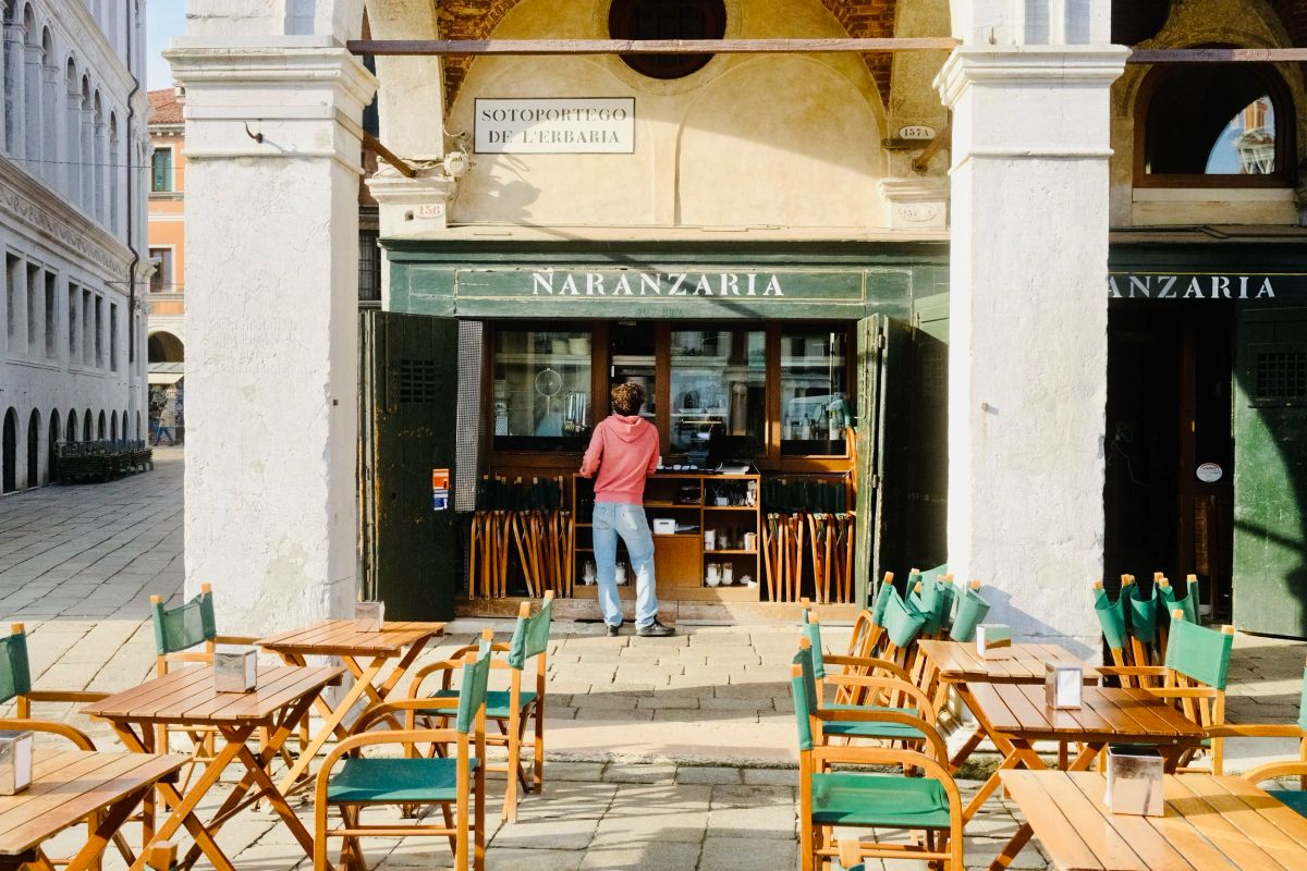 Morning light on the Naranzaria cafe terrace near the Rialto in Venice