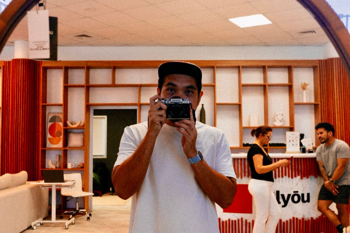Mark taking a mirror selfie with the Viltrox 28mm f/4.5 pancake lens on his Fujifilm X-T5