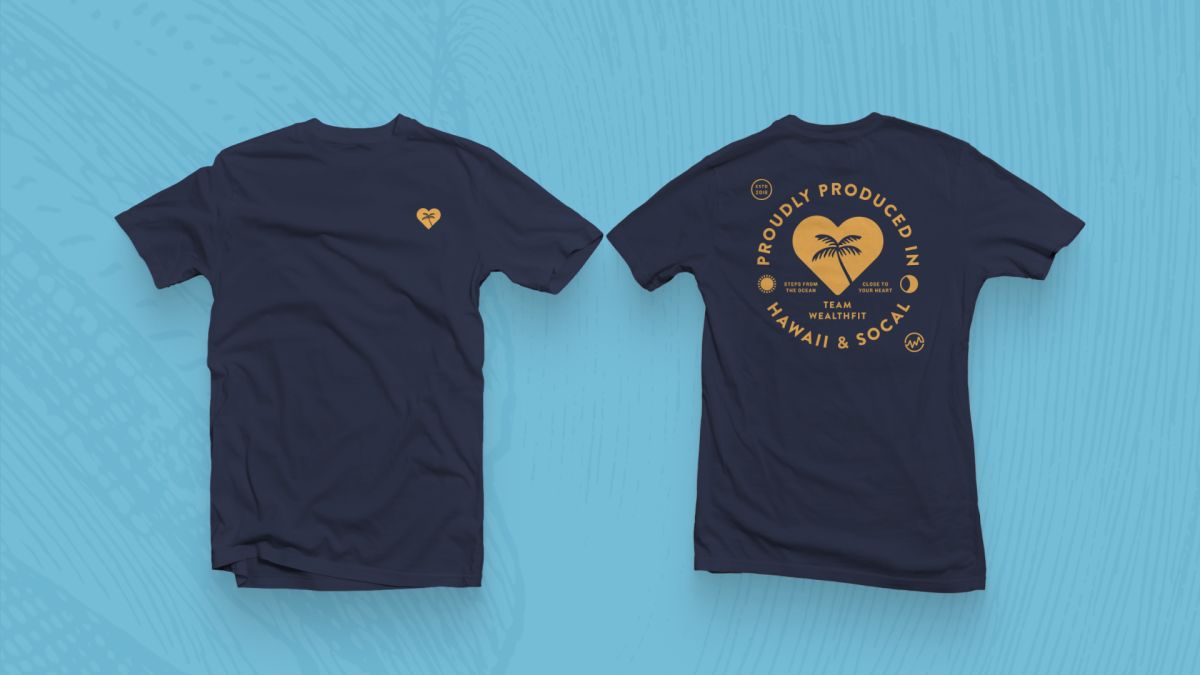 Front and back of a navy Team WealthFit T-shirt with a gold Proudly Produced in Hawaii & SoCal badge