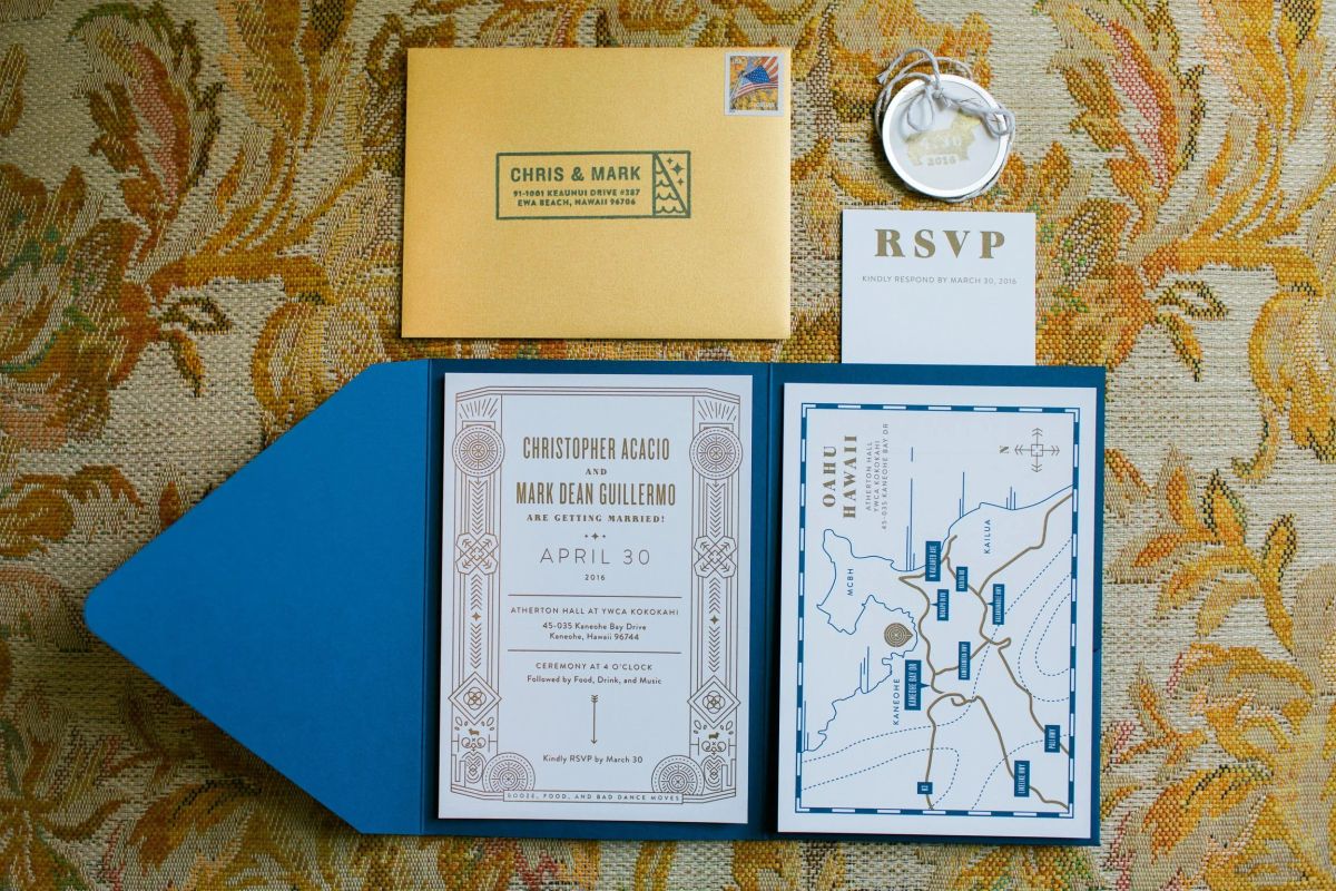 Wedding invitation suite with a gold envelope, RSVP card, blue folder, April 30 invitation and illustrated Oahu map