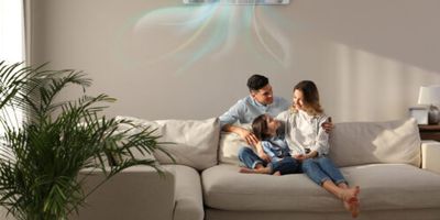 A young family cooling off in a room with a mini-split.