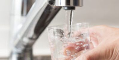 Someone getting a cool glass of water in Bountiful, UT