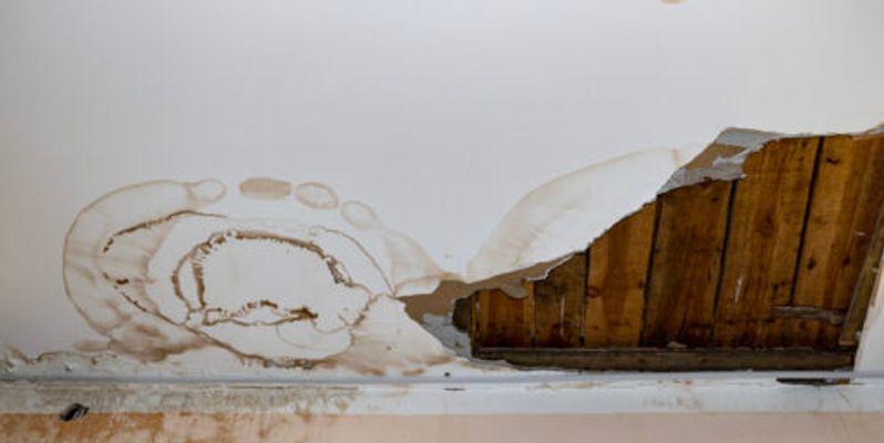 damage to ceiling and wall due to plumbing leak