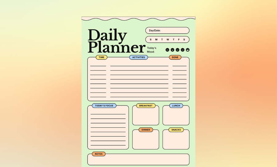 A person writing in a custom designed weekly planner on a wooden desk