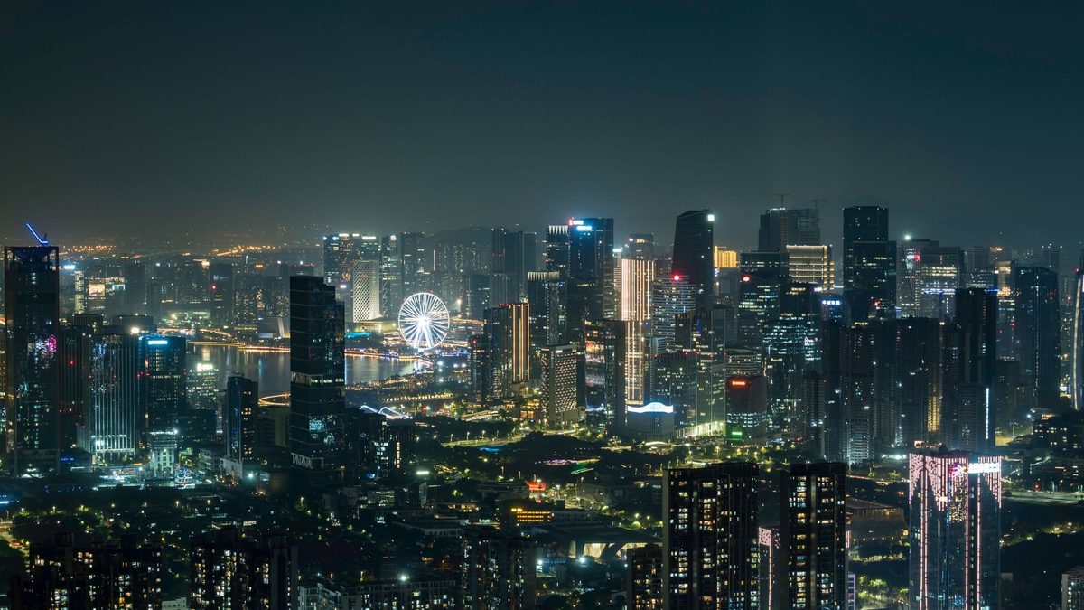 The Bay Glory observation wheel lit at night over Shenzhen's western bay