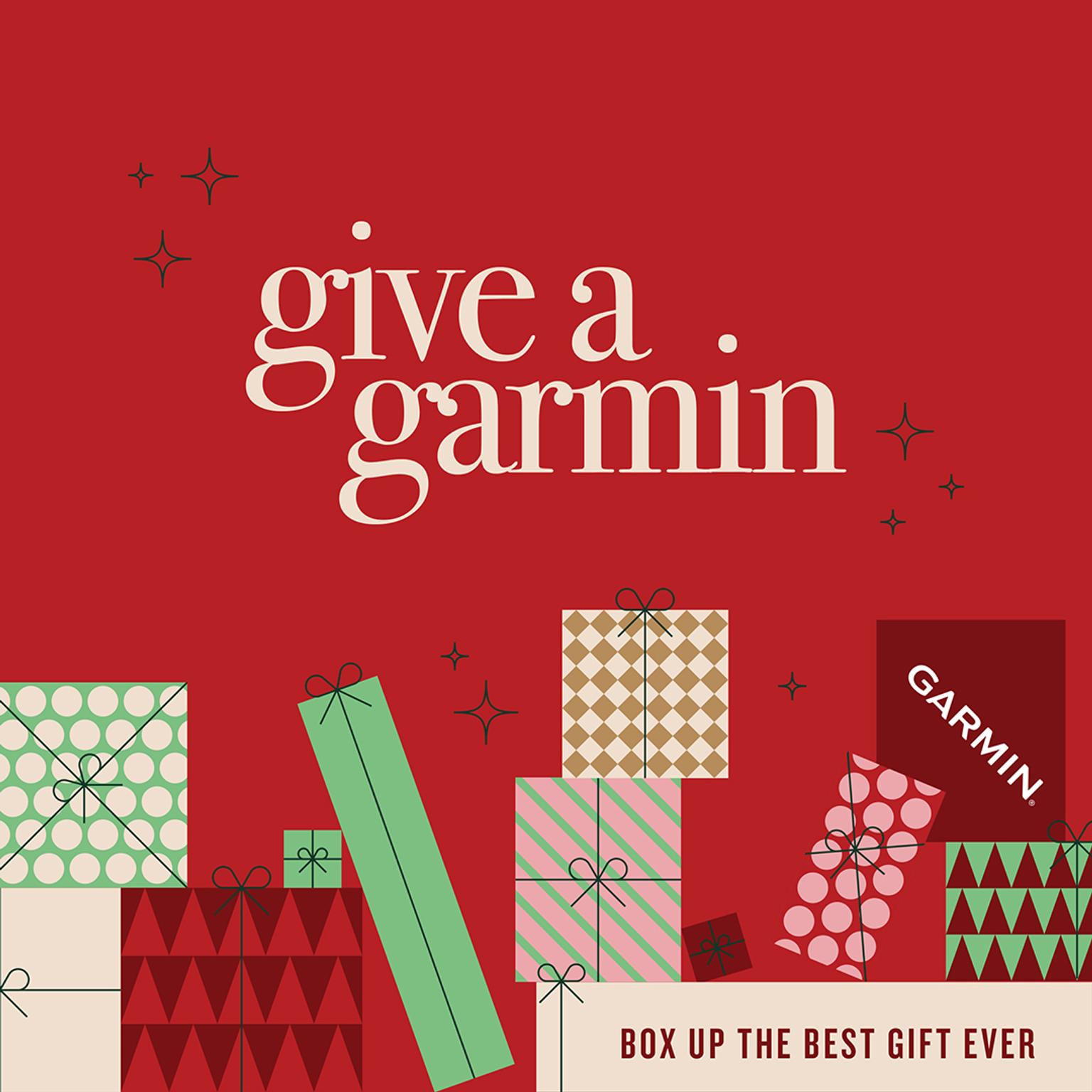 A red ad with "give a garmin" and "BOX UP THE BEST GIFT EVER" text above a pile of patterned gift boxes, one featuring the Garmin logo.