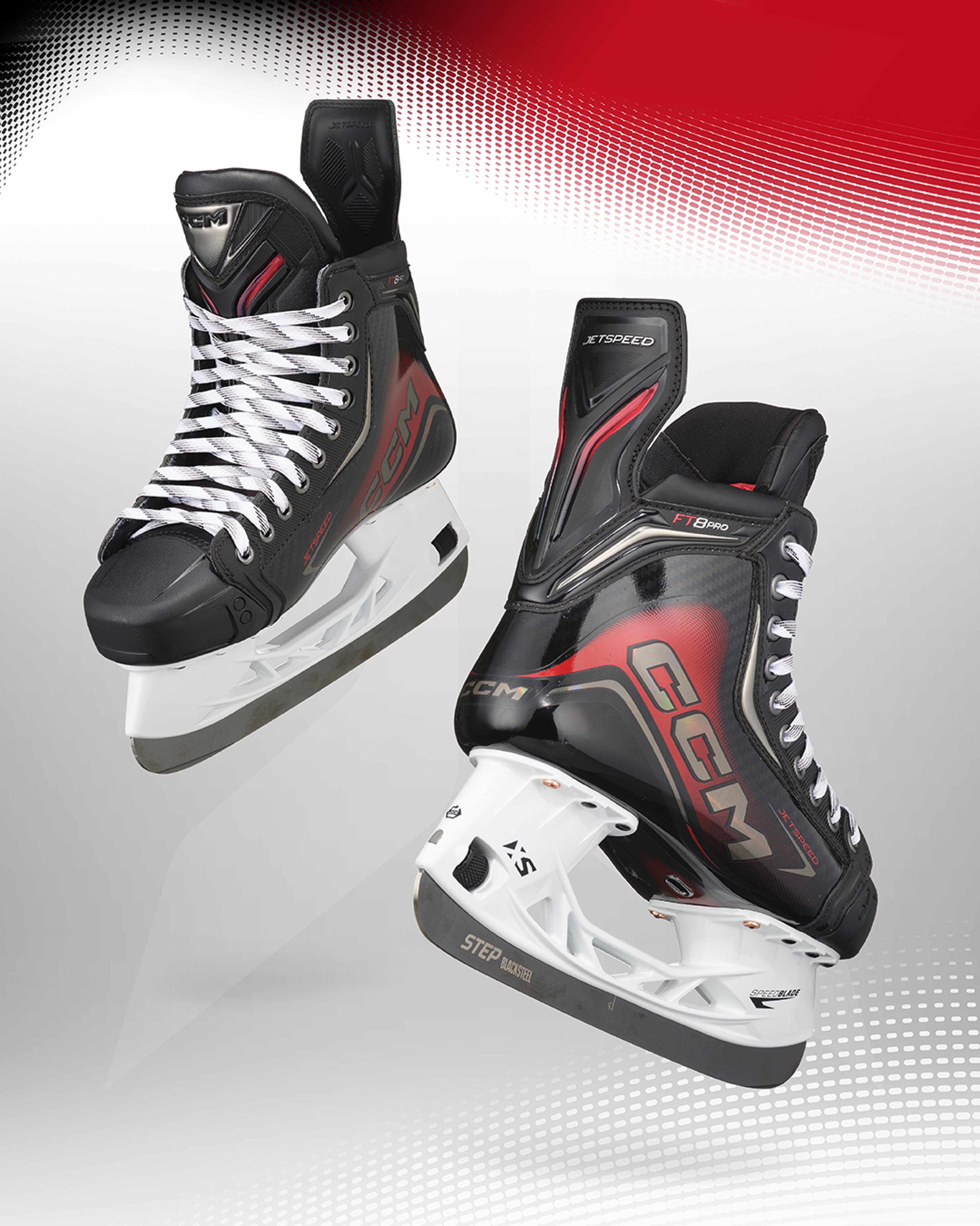 a pair of black and red ccm ice skates