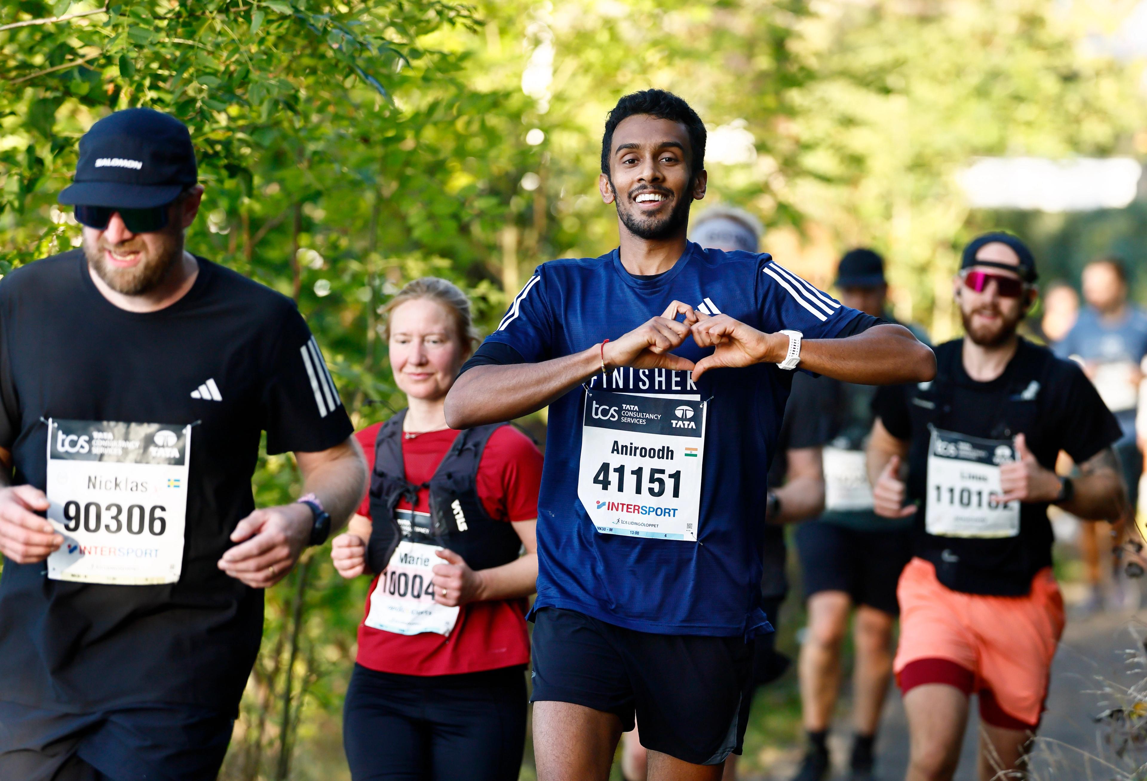 a group of people are running a marathon .