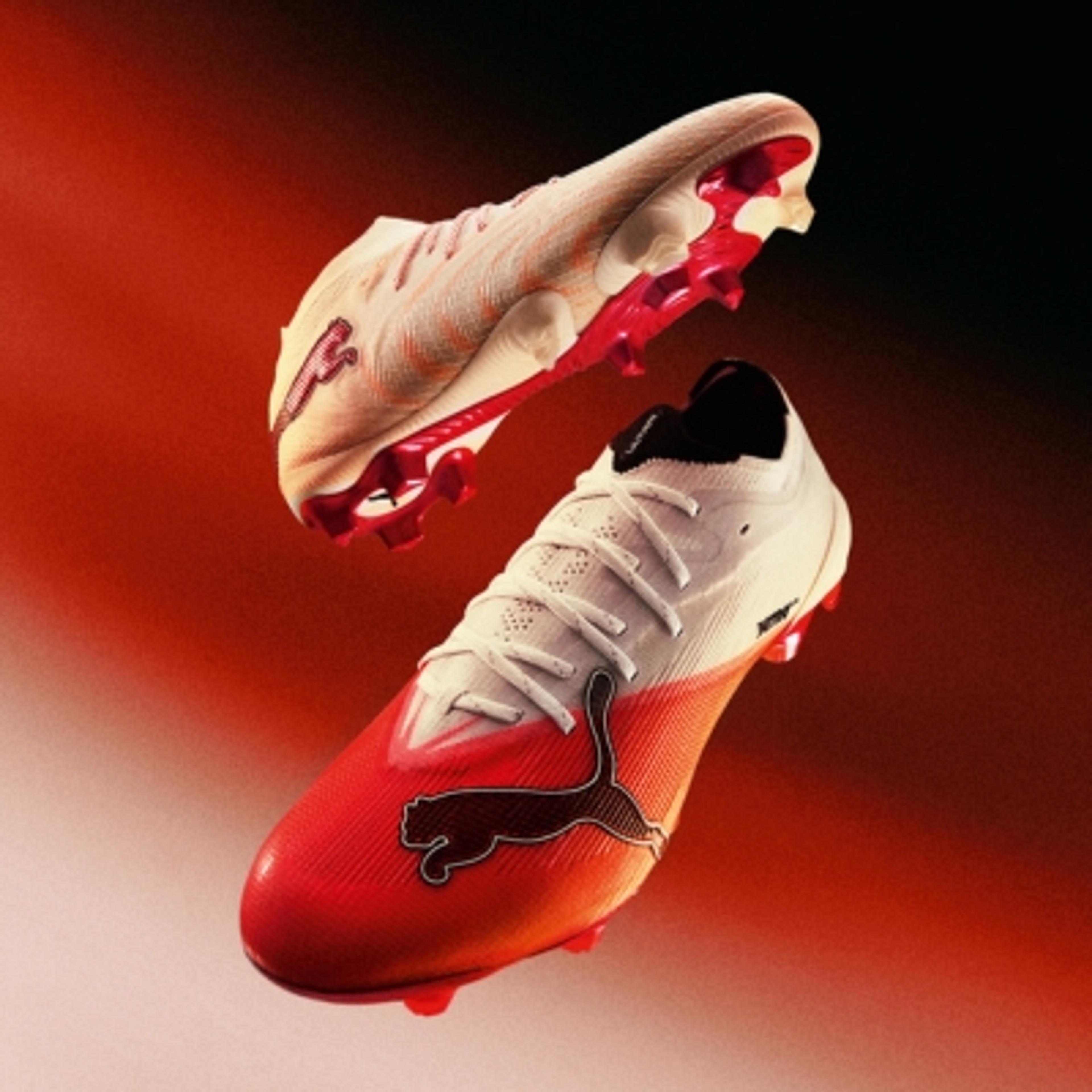 Two white and red Puma soccer cleats floating against a red gradient background.