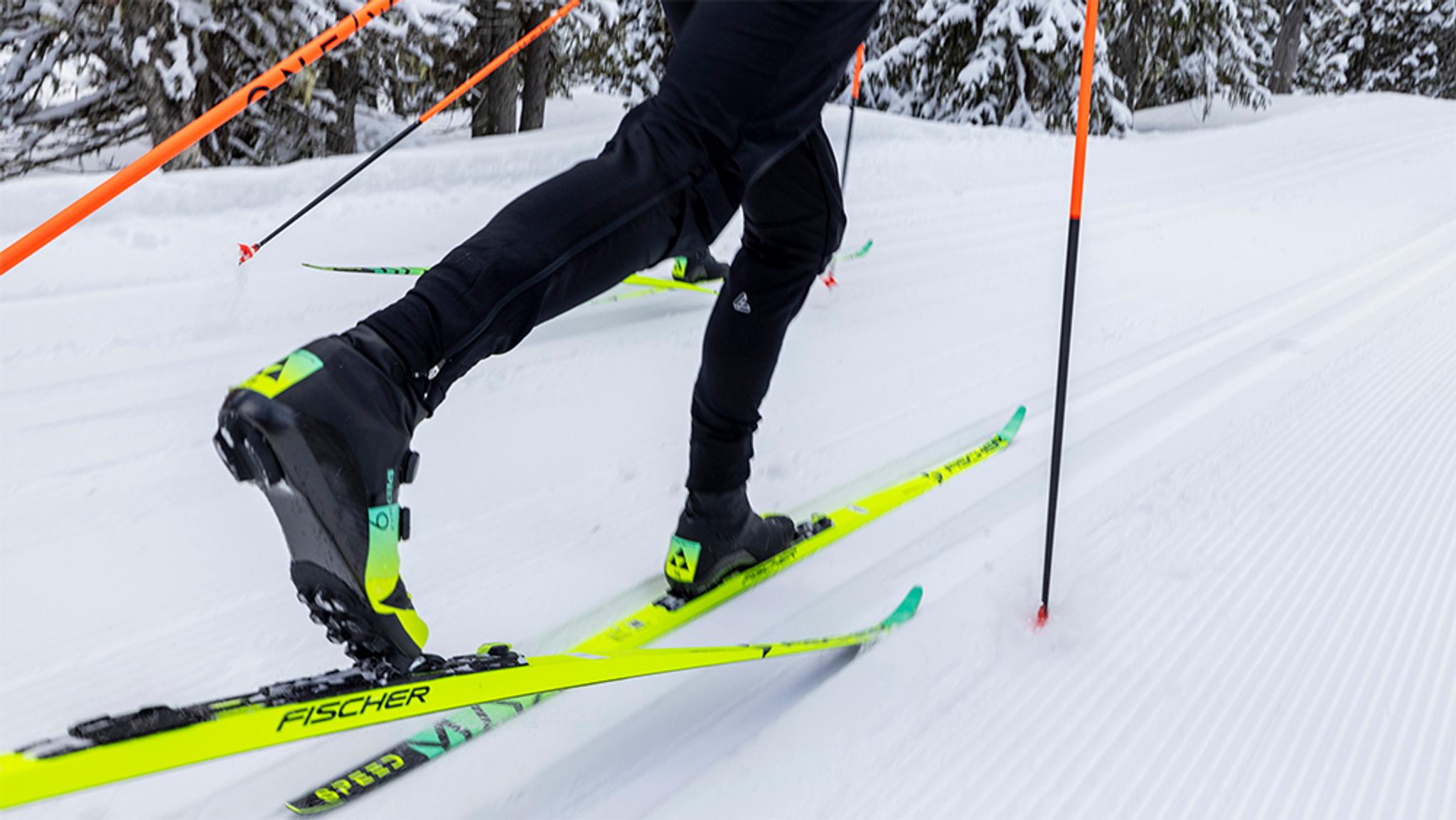 a person is skiing down a snow covered slope .