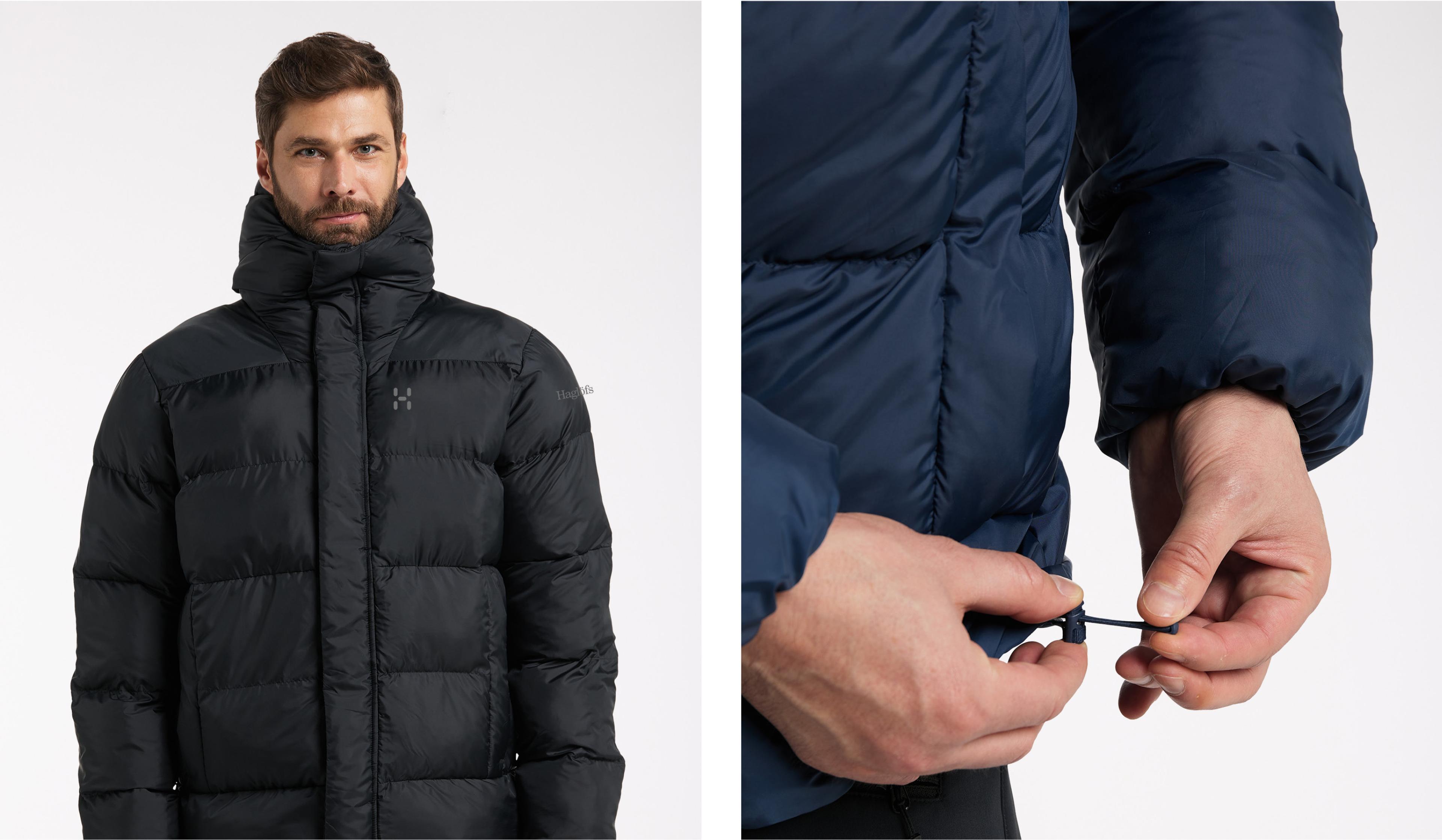 a man is wearing a black padded jacket with a hood .