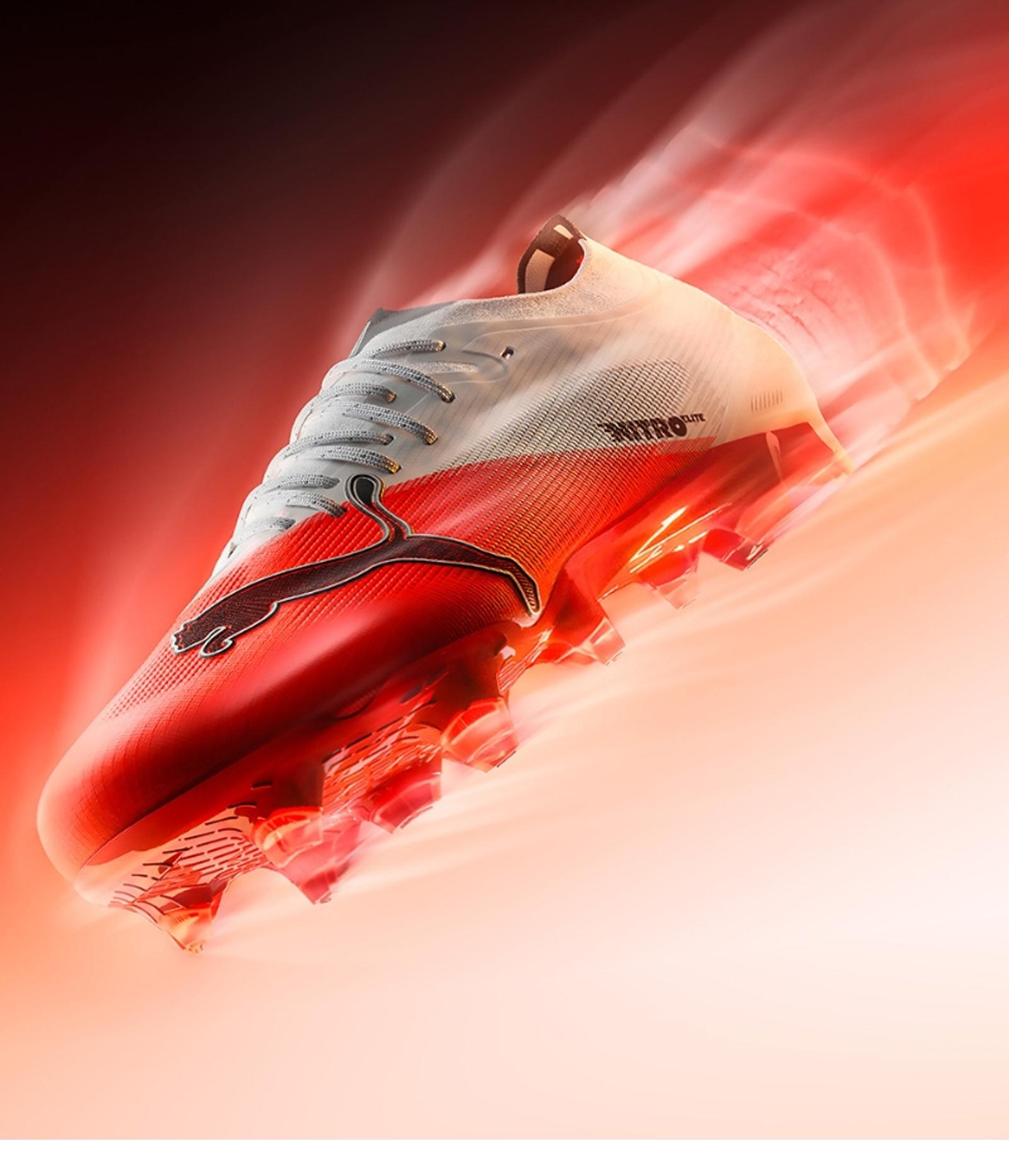 White and red Puma Nitro Elite soccer cleat with glowing red speed streaks.
