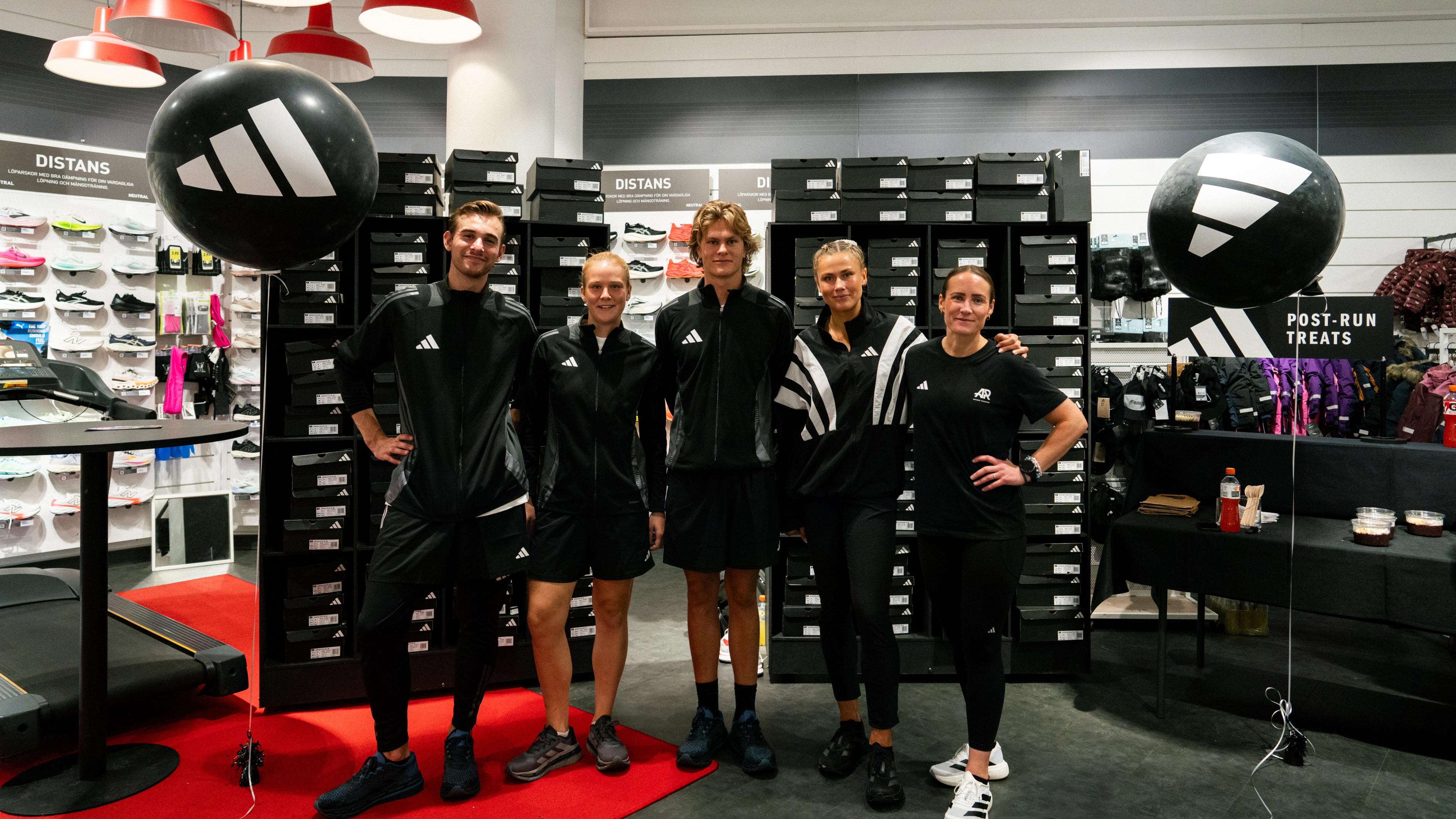 a group of people are posing for a picture in a store .