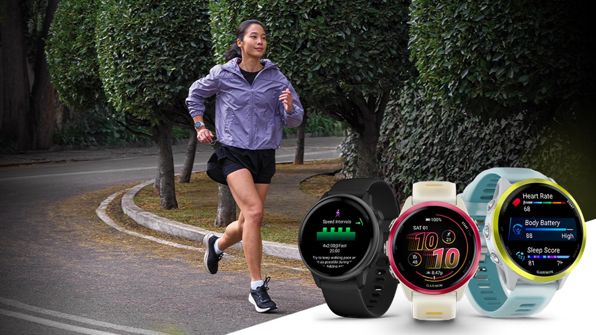 A woman running outdoors with three Garmin smartwatches displaying health and fitness data.