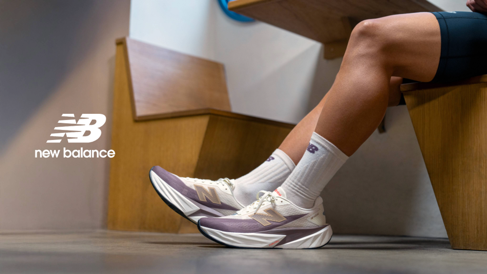 a person wearing a pair of new balance shoes