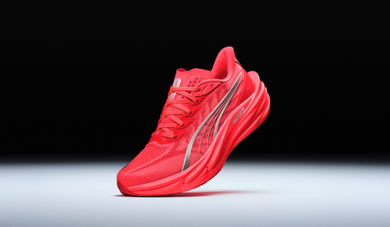 Bright red Puma running shoe with silver accents and "NITRO" branding.