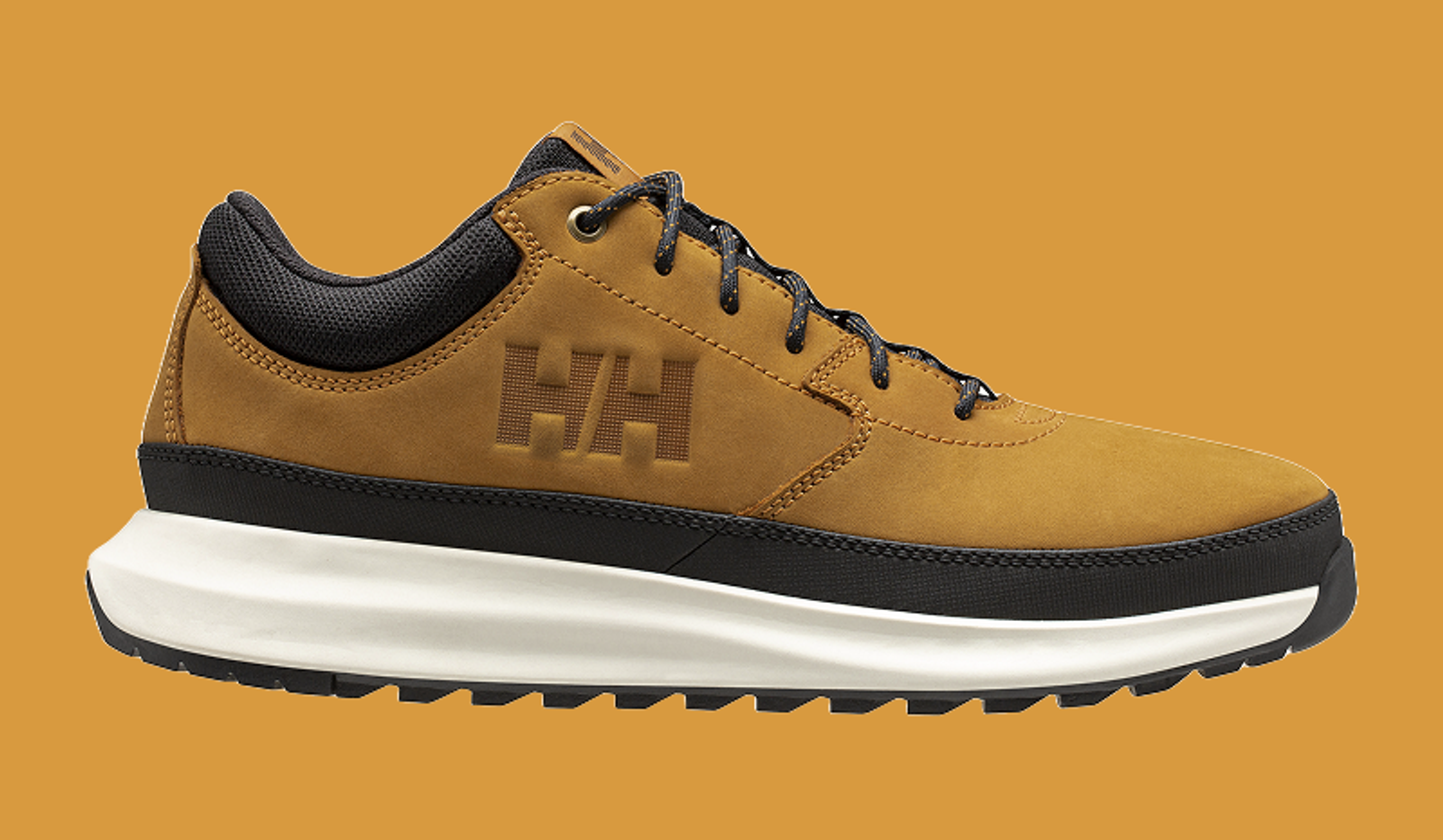 Tan Helly Hansen hiking shoe with black trim and white sole.