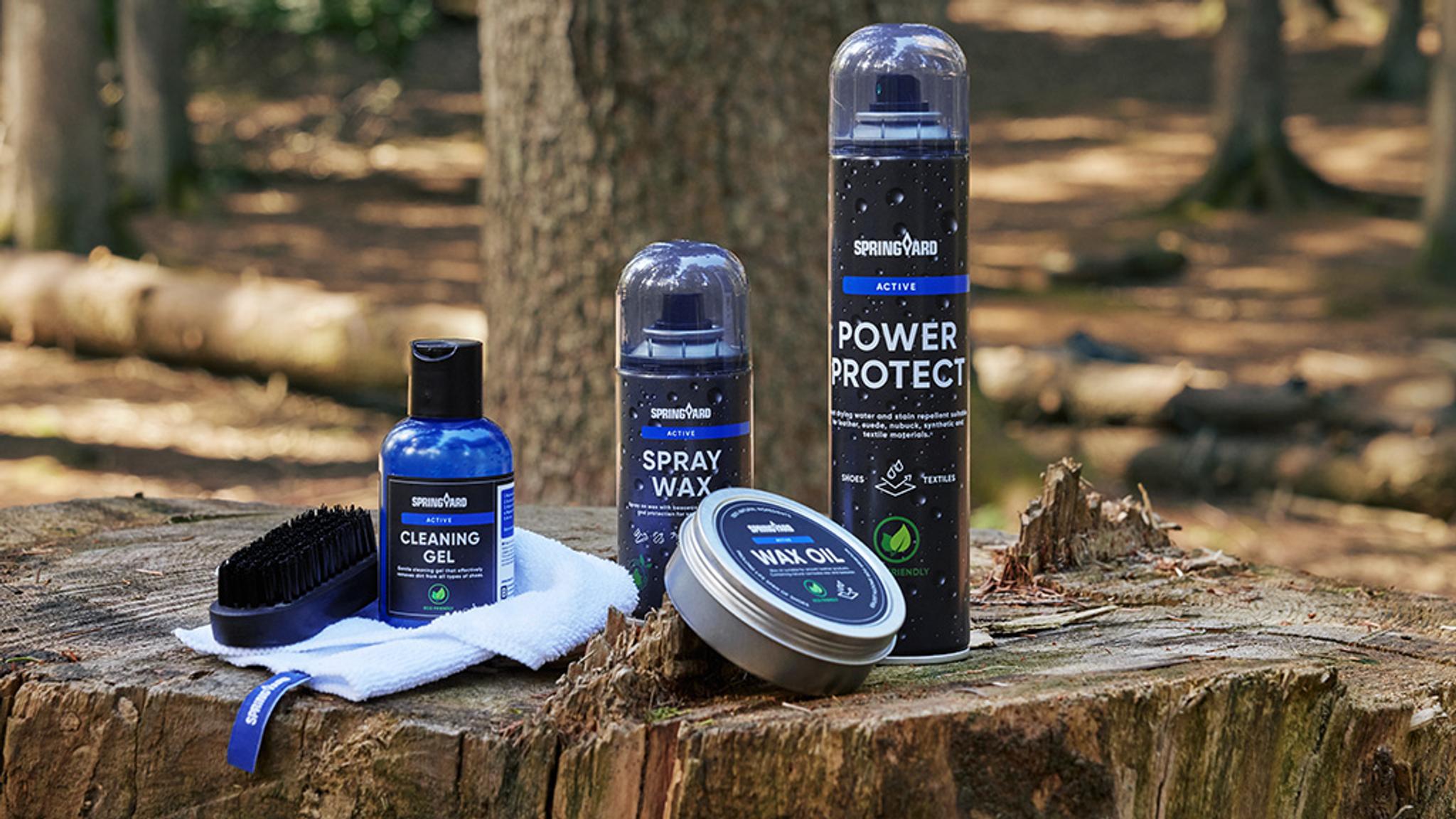 a group of bottles sitting on top of a tree stump .