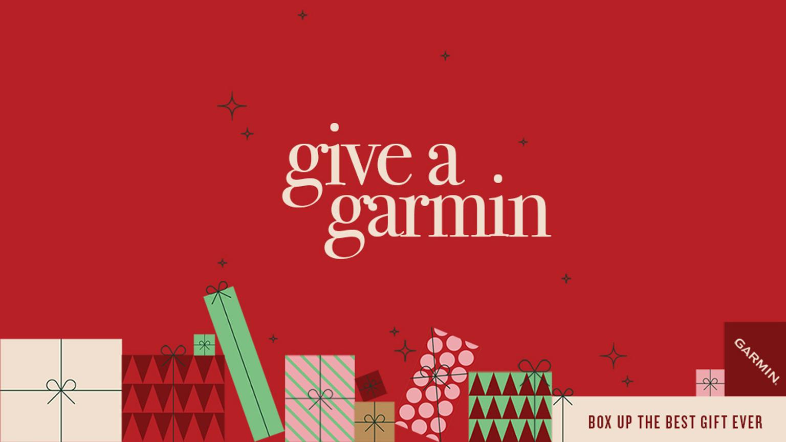 A red holiday ad featuring gift boxes and the text "give a garmin" and "BOX UP THE BEST GIFT EVER."