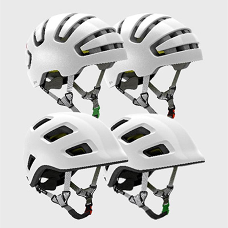 four white helmets are stacked on top of each other on a white background .