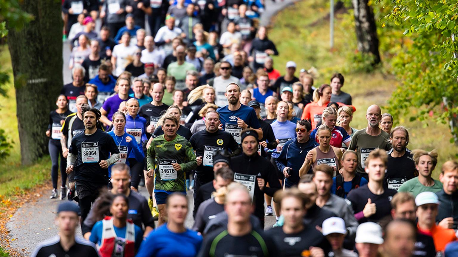 a large group of people are running a marathon.