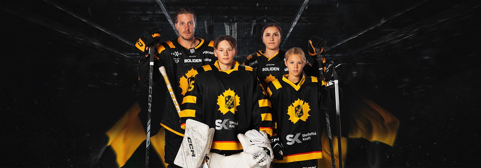 a group of hockey players are posing for a picture together .