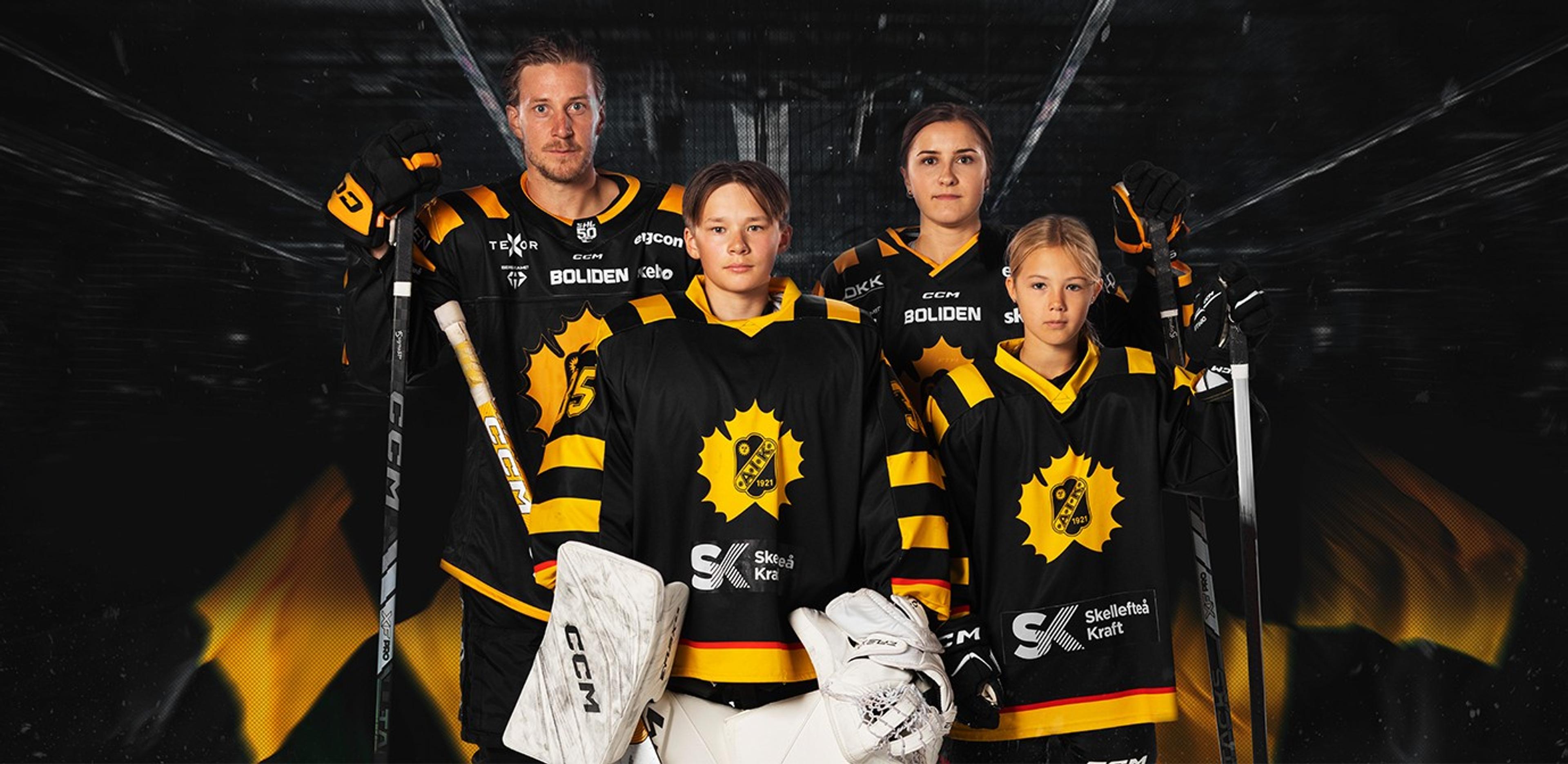 a group of hockey players are posing for a picture together .