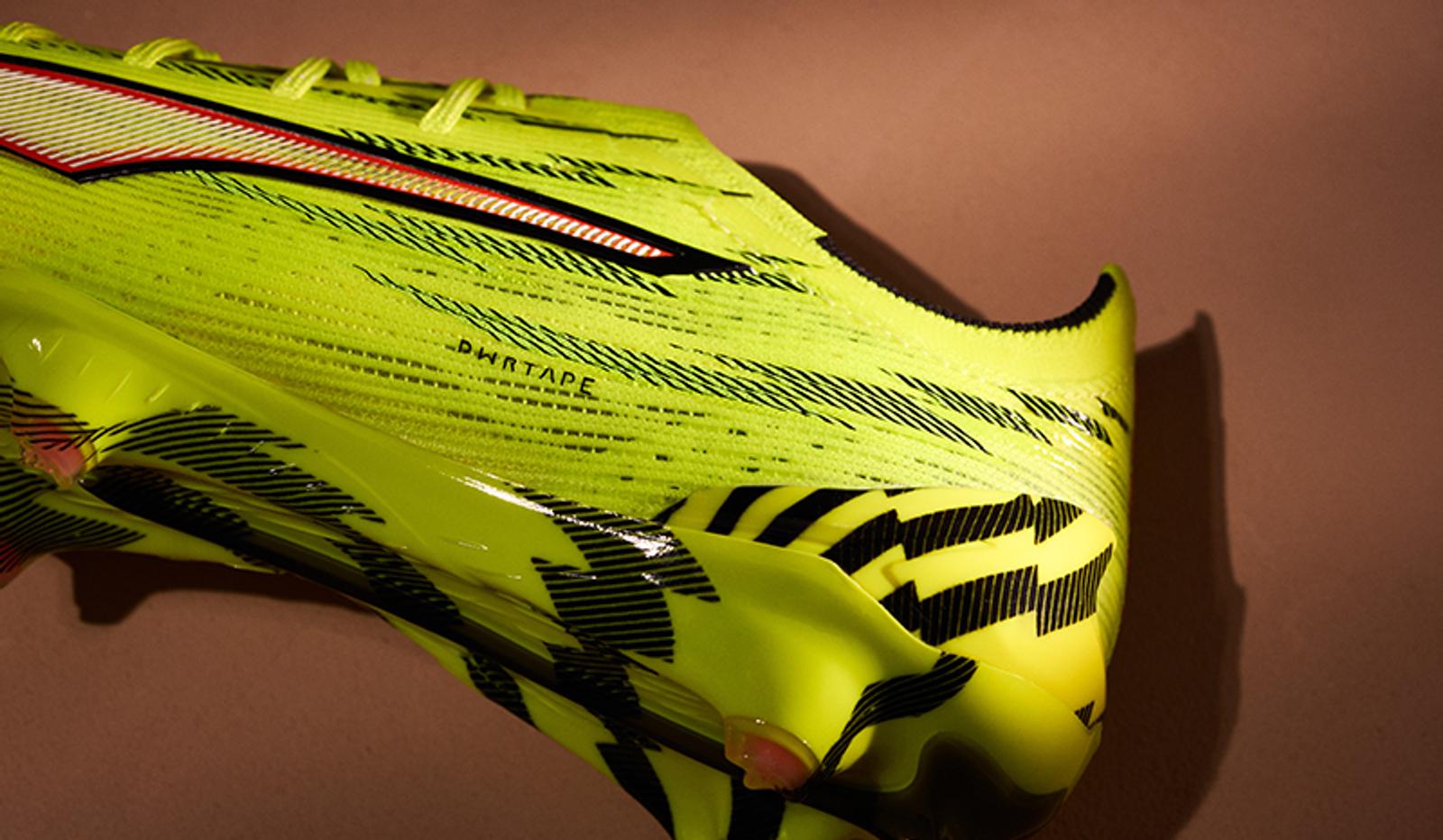 Close-up of a neon yellow athletic shoe with black stripes and "PHANTAPE" text.