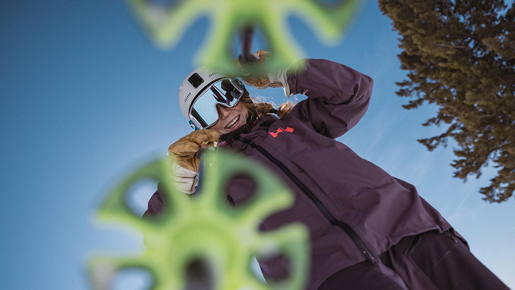 a group of people are skiing down a snow covered slope .