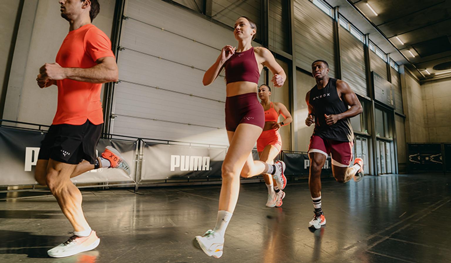 a woman is pushing a sled in a gym .